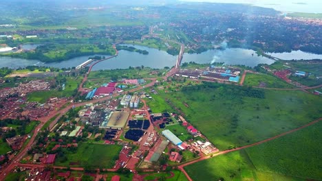 Aerial-View-Of-Nile-Breweries-And-Jinja-Nile-Bridge-On-White-Nile-River-In-Uganda