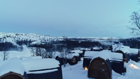 Aerial-View-Of-Snowhotel-Kirkenes-and-Gamme-Northern-Lights-Cabins-In-Bjornevatn,-Norway