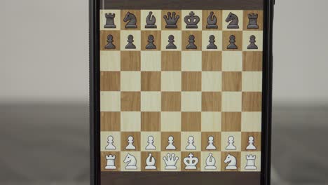 Game-interface-on-Smartphone-screen-displays-the-chessboard-and-pieces
