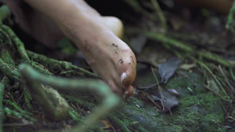 Close-up-of-a-girl's-wet-feet-on-the-river-bank-in-Salto-Encantado-park-located-in-Misiones,-Argentina