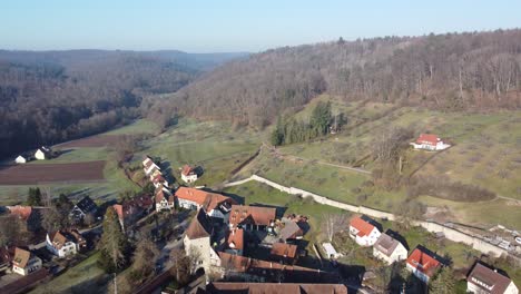 Aerial-view-of-the-idyllic-village-Bebenhausen-and-its-monastery-at-the-edge-of-Schönbuch-nature-park-near-Stuttgart-in-southern-Germany