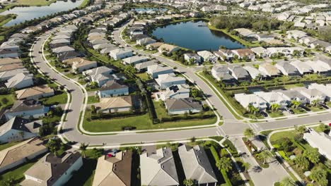 Aerial-of-a-sunny-suburban-Florida-neighborhood-in-tropical-climate