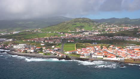 Faial-Island-establishing-aerial-shot-of-Horta,-windy-cloudy-day,-Atlantic-Ocean