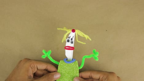 Disposable-plastic-knife-turned-into-toy-figurine-from-scrap-materials