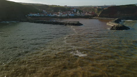 Low-Establishing-Drone-Shot-of-Staithes-Village-and-Harbour-Yorkshire-UK