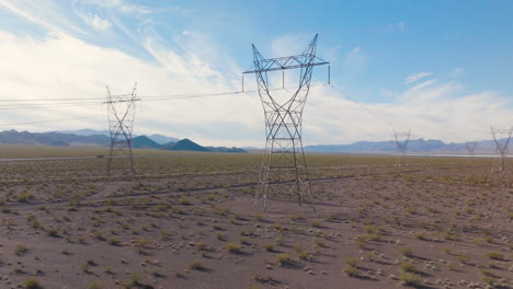 High-Volage-Power-Lines-in-a-Rural-Desert,-Aerial