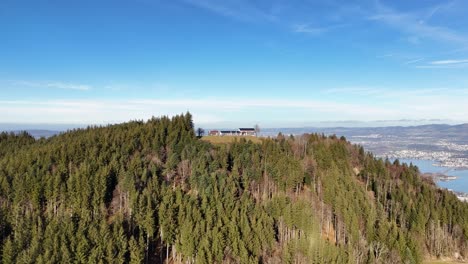 Mountain-Etzel-green-forest-landscape-reveal-view-Lake-Zurich-in-Switzerland