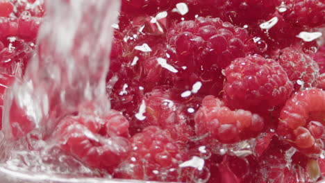 Water-falling-in-fresh-raspberry