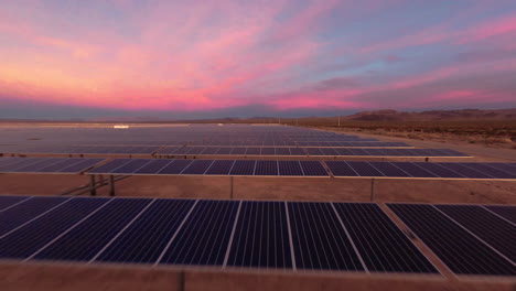 DPV-Drone-Flying-Over-Solar-Panels-in-a-Desert-Solar-Farm-at-Golden-Hour