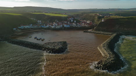 Pullback-Establishing-Drone-Shot-of-Staithes-Coastal-Village-Yorkshire
