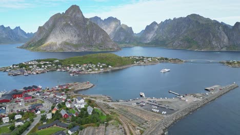 Reine-Harbour-and-Dock-in-Lofoten-Islands-Archipelago,-Norway,-Scandinavia---4k-Aerial-in-Summer