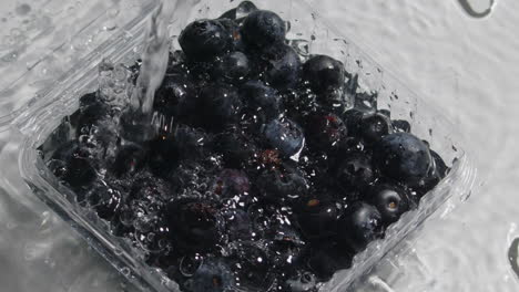 Water-falling-on-blueberries-in-slow-motion