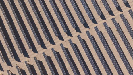Solar-Panel-Array-at-a-Solar-Farm-in-a-Desert,-Aerial-Top-Down