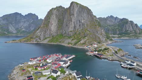 Hamnoy-Village-and-Red-Cabin-Houses-in-Lofoten-Islands,-Norway---Aerial-4k
