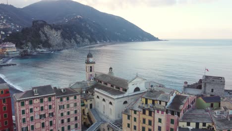 Camogli-coast,-Liguria,-in-Italy-with-clear-sea-in-winter-at-sunrise-and-aerial-view