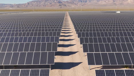 Solar-Farm-in-a-Desert-During-Daytime,-Aerial-Flyover