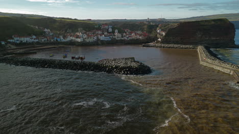 Low-Establishing-Drone-Shot-of-Staithes-Coastal-Village-Yorkshire-UK