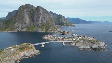 Scenic-Road-Bridge-to-Hamnoy-Village-and-Fjords-in-Lofoten-Islands,-Norway---Aerial-4k