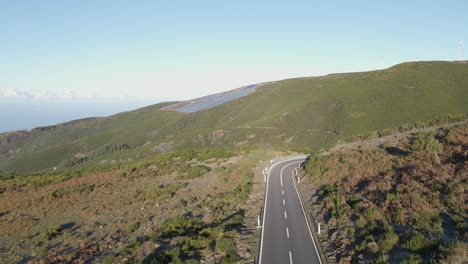 Aerial-view-of-a-photovoltaic-farm-and-a-wind-farm-on-top-of-a-mountain-in-Paul-da-Serra-Madeira-island