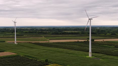 Wind-turbines-in-rural-area,-modern-power-production-technology-in-Poland,-Europe