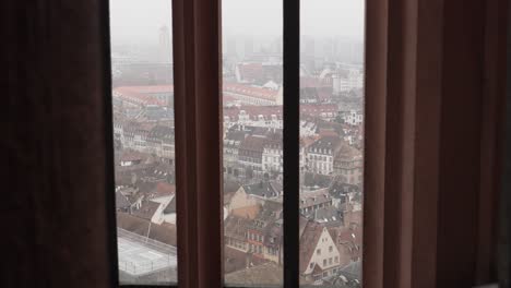 View-from-the-Strasbourg-Cathedral,-glimpsing-onto-charming-streets-and-rooftops-of-Strasbourg,-with-culture-and-architecture-blending-German-and-French-influences
