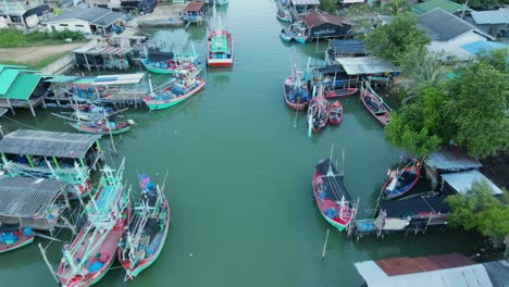 Reverse-footage-of-this-fishing-village-revealing-fishing-boats-and-communities,-Bang-Pu-Fishing-Village,-Sam-Roi-Yot-National-Park,-Prachuap-Khiri-Khan,-Thailand