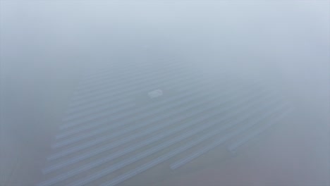 Solar-panel-photovoltaic-farm-on-cloudy-and-foggy-day