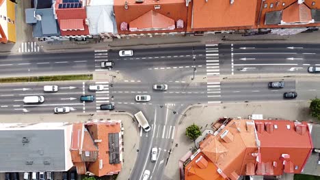 Top-down-view-of-red-rooftops-and-street-intersection