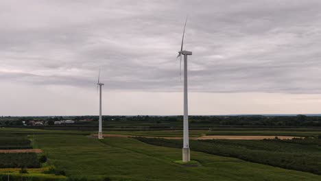 Rotating-wind-turbines-in-fields,-alternative-power-source-development,-Poland