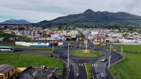 Town-name-Aloasi-placed-at-road-entrance-with-El-Corazón-volcano-backdrop