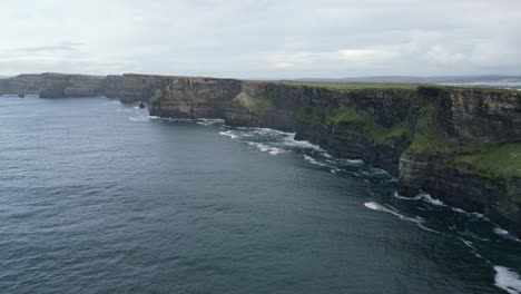Slow-motion-rising-shot-revealing-the-vast-cliffs-of-Moher-on-the-Ireland-coast