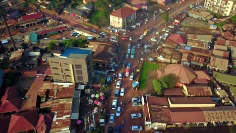 Aerial-View-Over-Rush-Hour-Traffic-In-Kampala,-Uganda---Drone-Shot