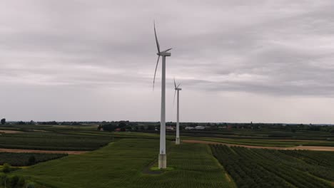Rural-landscape-with-wind-turbines-for-electric-power-supply,-green-energy-technology