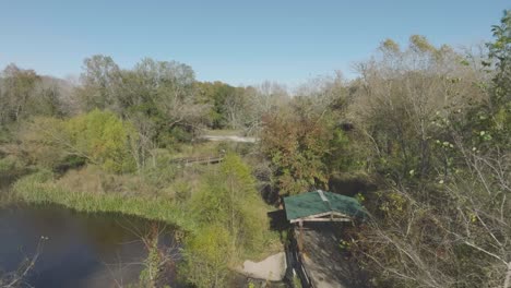An-aerial-view-captures-the-gazebo-and-boardwalk-winding-through-the-UHCL-wetlands,-leading-to-Horsepen-Bayou-in-Clear-Lake,-Houston,-Texas