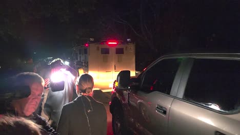 SWAT-truck-driving-past-news-media-in-Lewiston,-Maine-Mass-Shooting-Manhunt