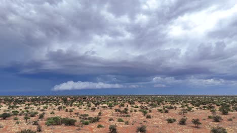 Flying-over-the-southern-Kalahari-landscape-while-a-thunderstorm-arrives