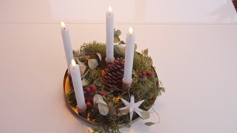 Turning-On-Electric-Candles-on-Christmas-Advent-Wreath