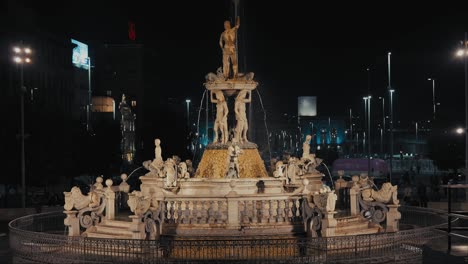 Neptune-fountain-at-night-in-Naples,-Italy