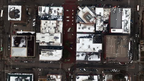 Christmas-in-Boulder-Colorado-Pearl-Street-Mall-Baseline-aerial-drone-cinematic-December-University-of-Colorado-CU-Buffs-Winter-cloudy-snowy-Flat-Irons-Chautauqua-Park-cars-buildings-streets-upward