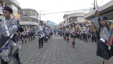 Young-uniformed-marching-band-parade-town-streets-Day-of-Independence-slow-mo