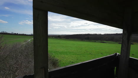 Skyline-and-Green-Fields-Landscape-Timelapse-from-Hunting-Watchtower-Window-POV