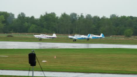 Zlin-Z-526-airplanes-perform-synchronized-take-off-shape-during-airshow