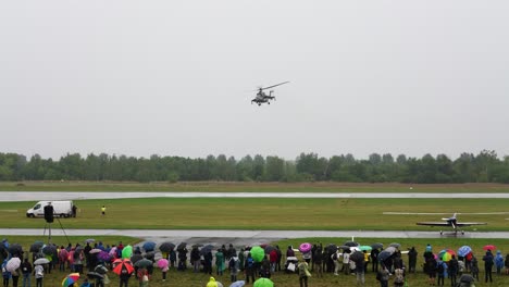 Military-helicopter-perform-sideways-maneuver-in-front-of-people-during-airshow