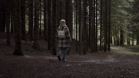 Girl-walking-in-fall-forest