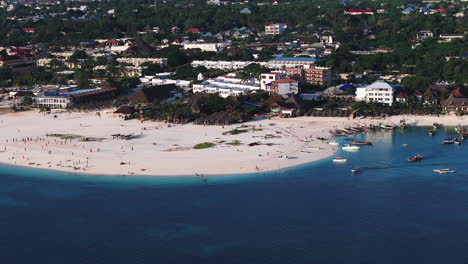 Kendwa-beach-where-tourists-and-locals-mix-together-of-colors-and-joy,-concept-of-summer-vacation,-aerial-view-of-zanzibar,-Tanzania