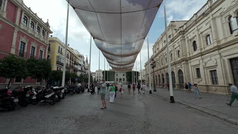 Tourism-walking-under-the-Metropol-Parasol-in-Sevilla-on-a-summer-day