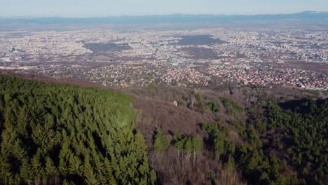 Cinematic-clip-over-an-area-of-Vitosha-mountain-massif-with-the-city-of-Sofia,-Bulgaria-in-the-background