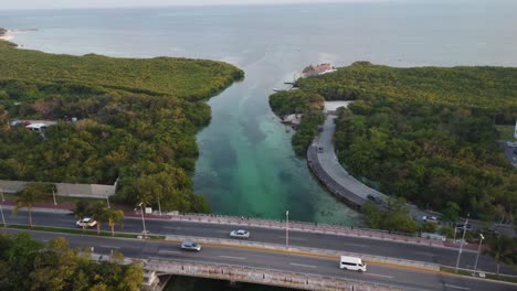 Aerial-shot-overhead-Punta-Nizuc-Bridge-showing-the-boating-lane-into-the-port