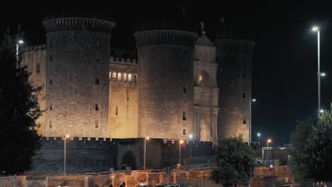 Castel-Nuovo-lit-up-at-night,-Naples,-Italy