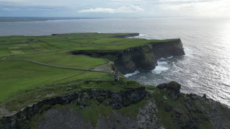 Stunning-aerial-view-of-Moher-Tower-at-Hag's-Head-and-Ireland-Cliffs-at-sunset
